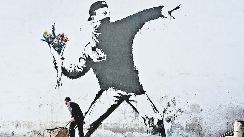 Mural de Banksy en una pared de Palestina.