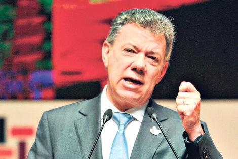 Santos urgió a implementar el acuerdo para evitar un nuevo brote violento. (Fuente: AFP)