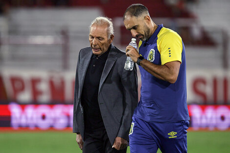 Russo junto al preparador físico.