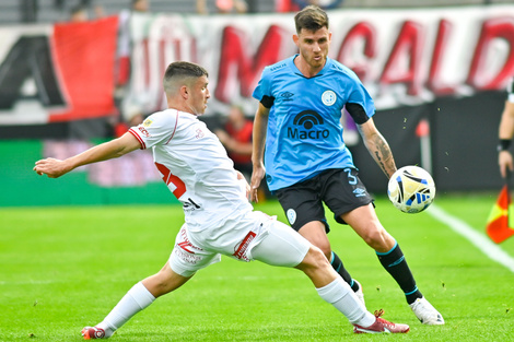 Adrián Sporle vs. Facundo Mater. El lateral de Belgrano fue clave.
