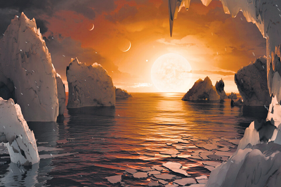 Uno de los planetas, el Trappist-1f, tal como lo imagina la NASA, con océanos y zonas tal vez habitables. (Fuente: EFE)