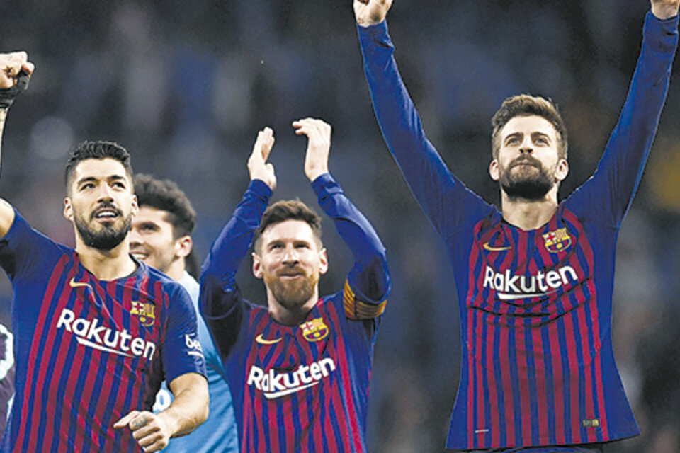 Lionel Messi, Luis Suárez y Gerard Piqué festejan en el Bernabéu. (Fuente: AFP)