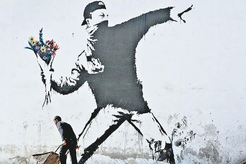 Mural de Banksy en una pared de Palestina.