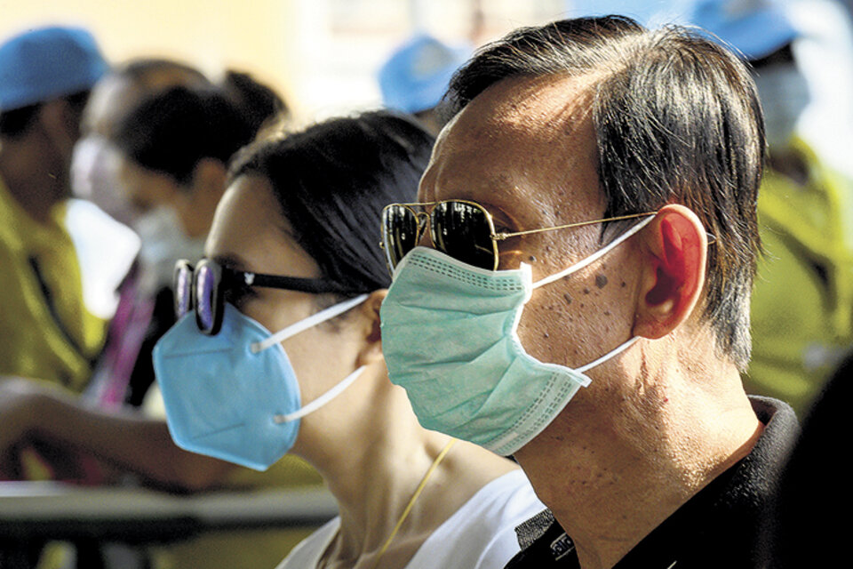Para la OMS, la escalada de contagios fuera de China es "muy preocupante", advirtió el director del organismo.  (Fuente: AFP)