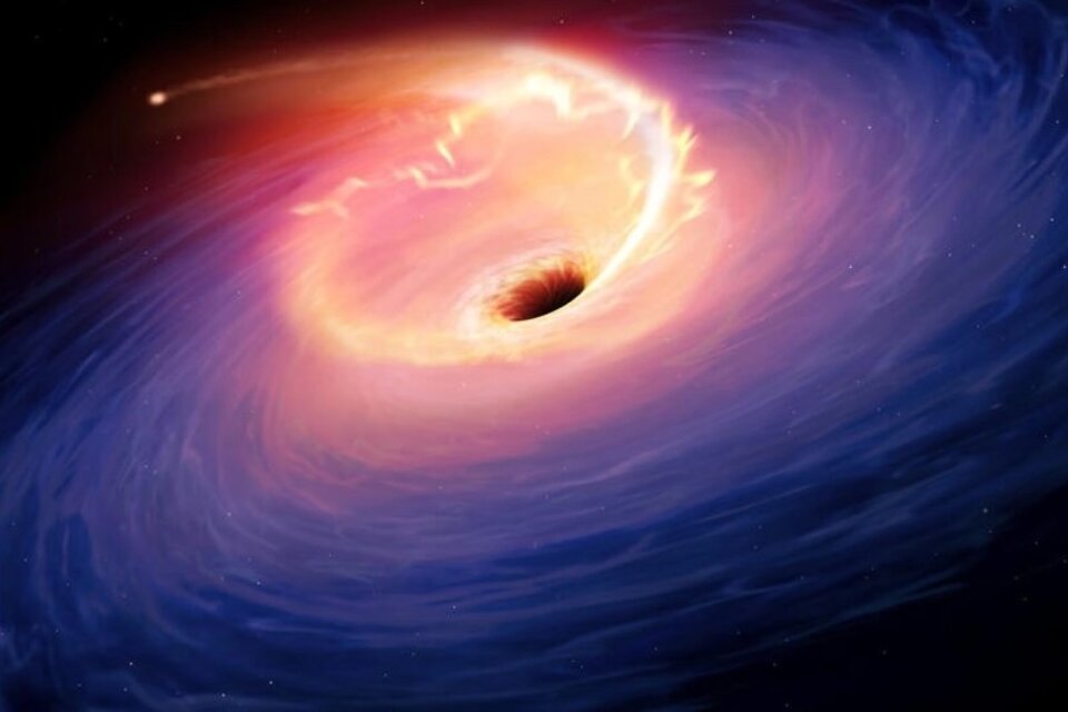 Una ilustración del momento en que una estrella es absorbida por un agujero negro (Foto: AFP).