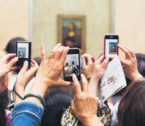 En 2012 el británico Martin Parr fotografió a turistas capturando a la Gioconda con sus smartphones en el Museo del Louvre.