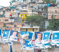 Propaganda electoral de Hernández y del PN en Tegucigalpa. (Fuente: AFP) (Fuente: AFP) (Fuente: AFP)