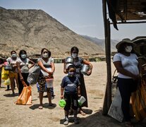 Comas, Perú. Falta de acceso a servicios básicos, uno de los problemas prevalecientes que agravó el impacto de la pandemia. (Fuente: AFP) (Fuente: AFP) (Fuente: AFP)