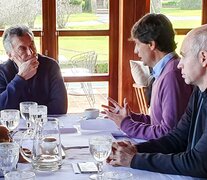 Mauricio Macri escuchando a Hernán Lacunza, jefe del equipo económico del candidato a presidente Horacio Rodríguez Larreta. (Fuente: NA) (Fuente: NA) (Fuente: NA)