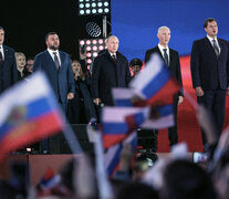 Putin (centro) canta el himno ruso durante la ceremonia de anexión en Moscú. (Fuente: AFP) (Fuente: AFP) (Fuente: AFP)