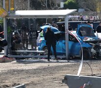 Perito y policías trabajan en la escena del crimen. (Fuente: AFP) (Fuente: AFP) (Fuente: AFP)