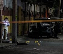 Un miembro del equipo forense trabaja en la escena del asesinato de Gaytán Gutiérrez. (Fuente: AFP) (Fuente: AFP) (Fuente: AFP)